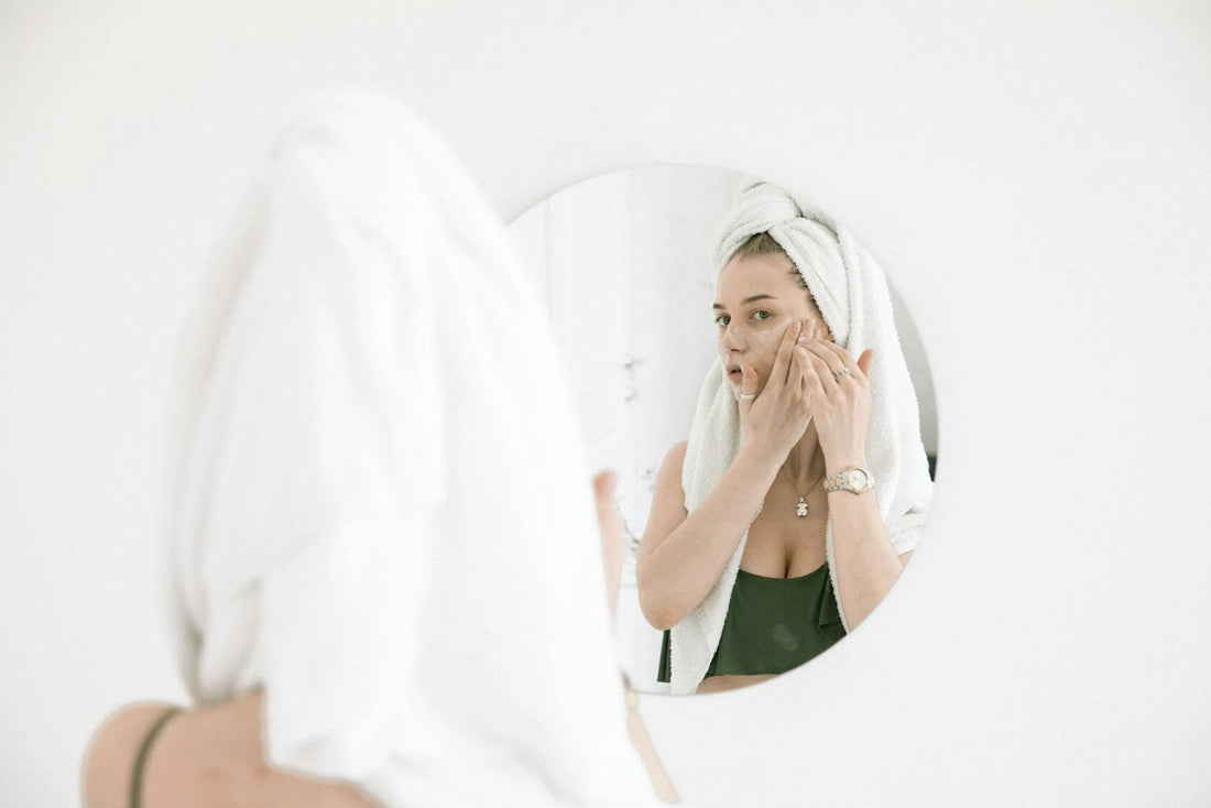 a woman applying face cream